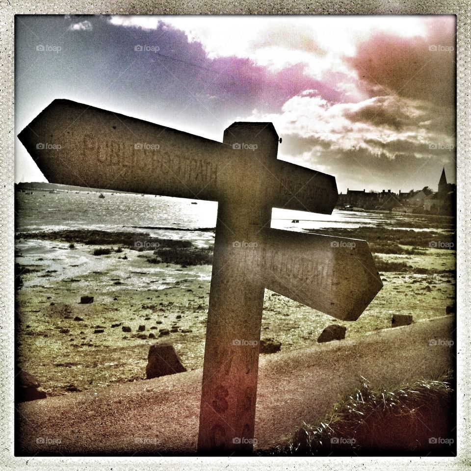 Harbour Walk . Public footpath signposting the way in Bosham Harbour, UK 