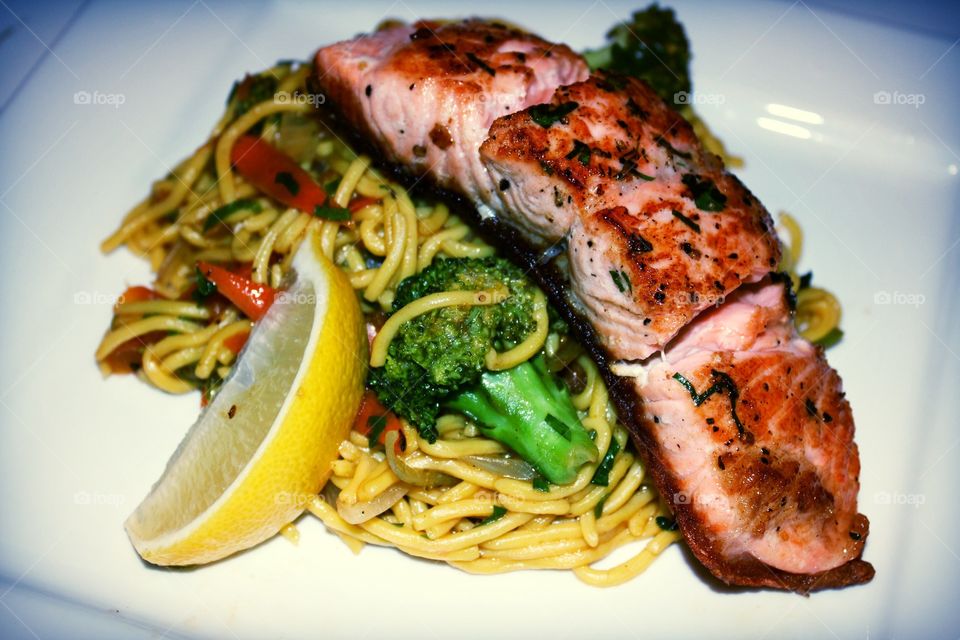 Salmon with noodles veggie stir fry