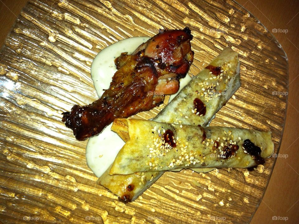 Chicken with dates and  cigars stuffed with meat raisins and tahini sauce