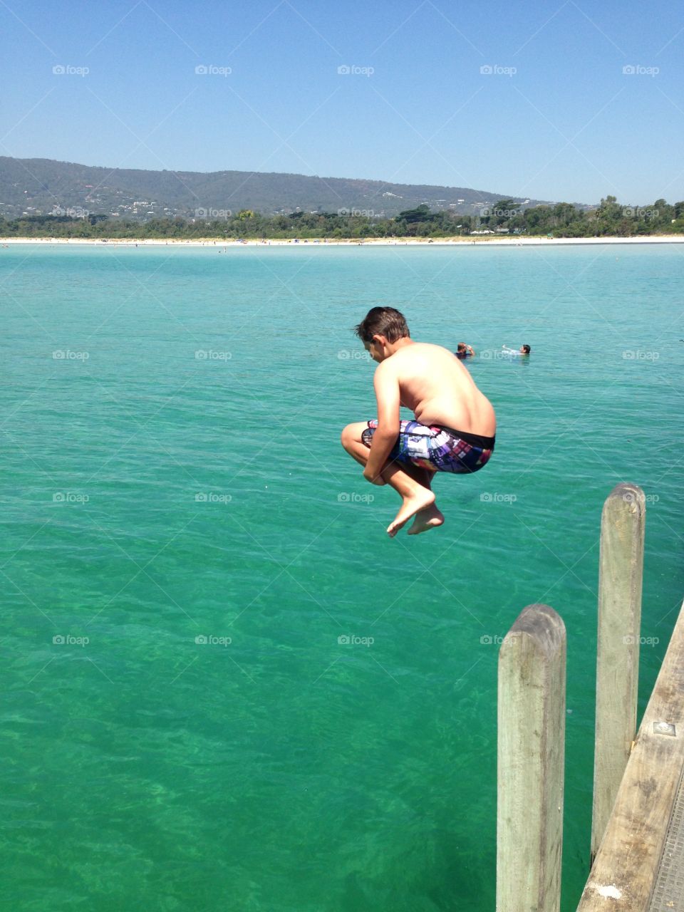 Having fun jumping off the Rosebud Pier
