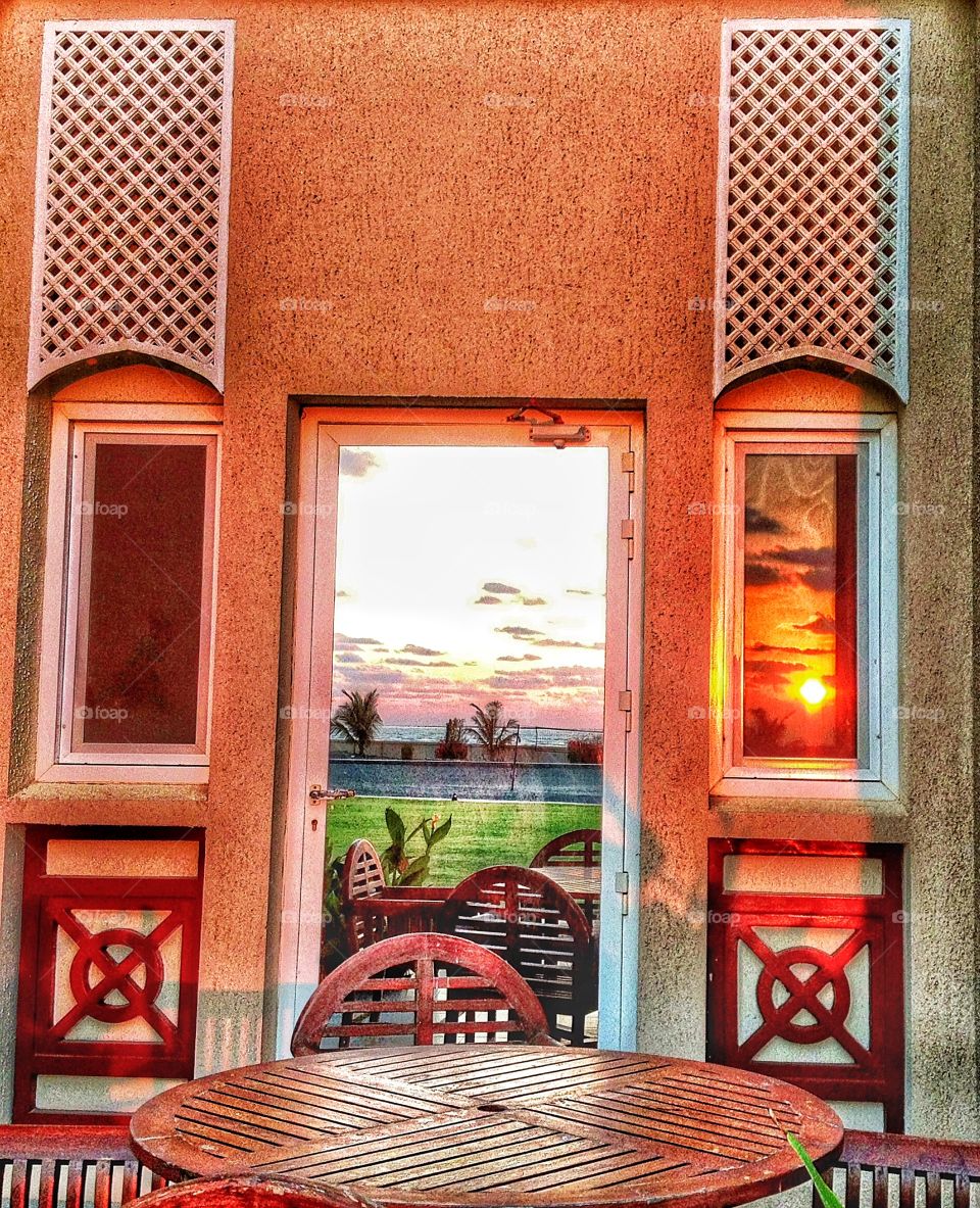 Reflections in a window of Mashira Island Oman