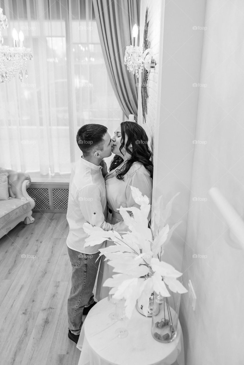 couple in love kissing black and white photo