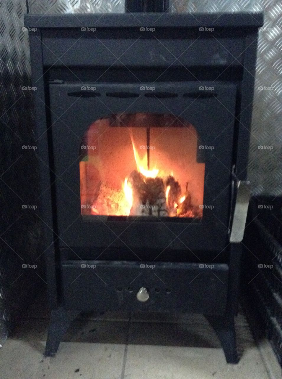 Wood stove with fire burning.