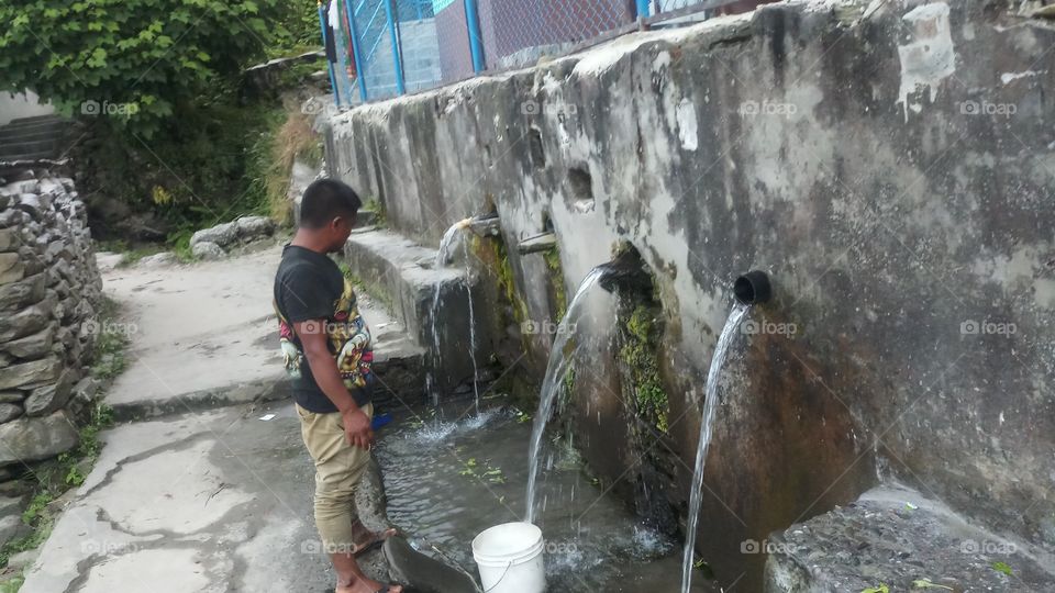 Stone Tap in mountain Village..