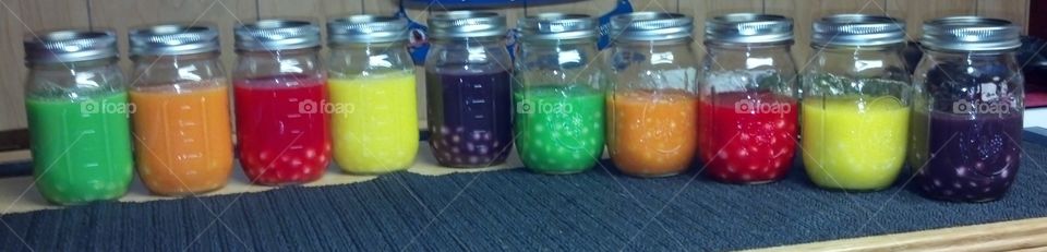 Colorful jars of candy infusing vodka