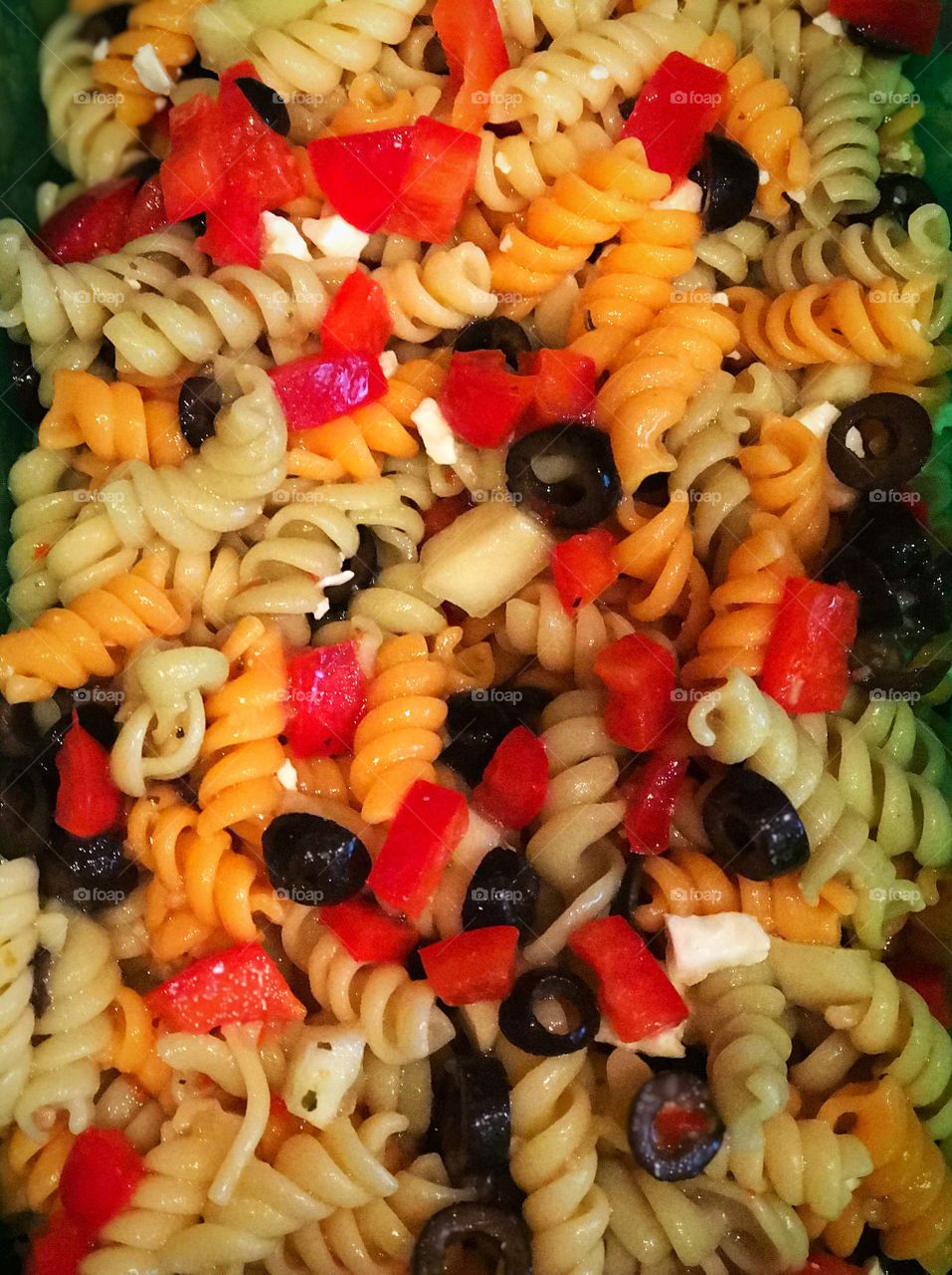 Pasta salad with fresh vegetables and feta cheese