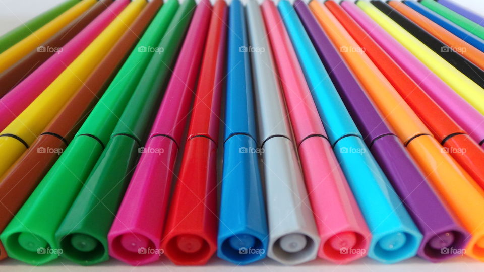multicoloured pens rowed up