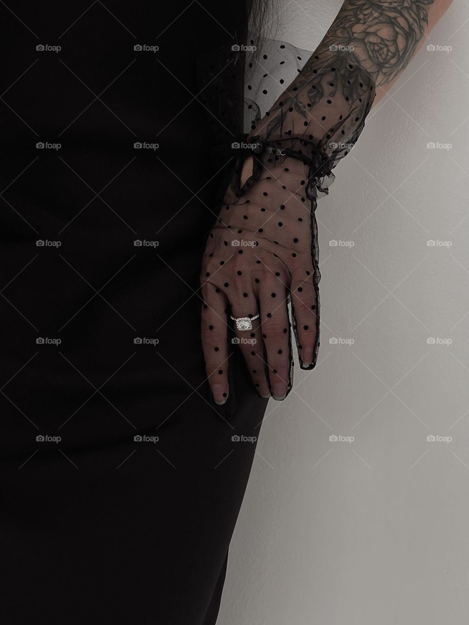 Silver ring and black gloves 