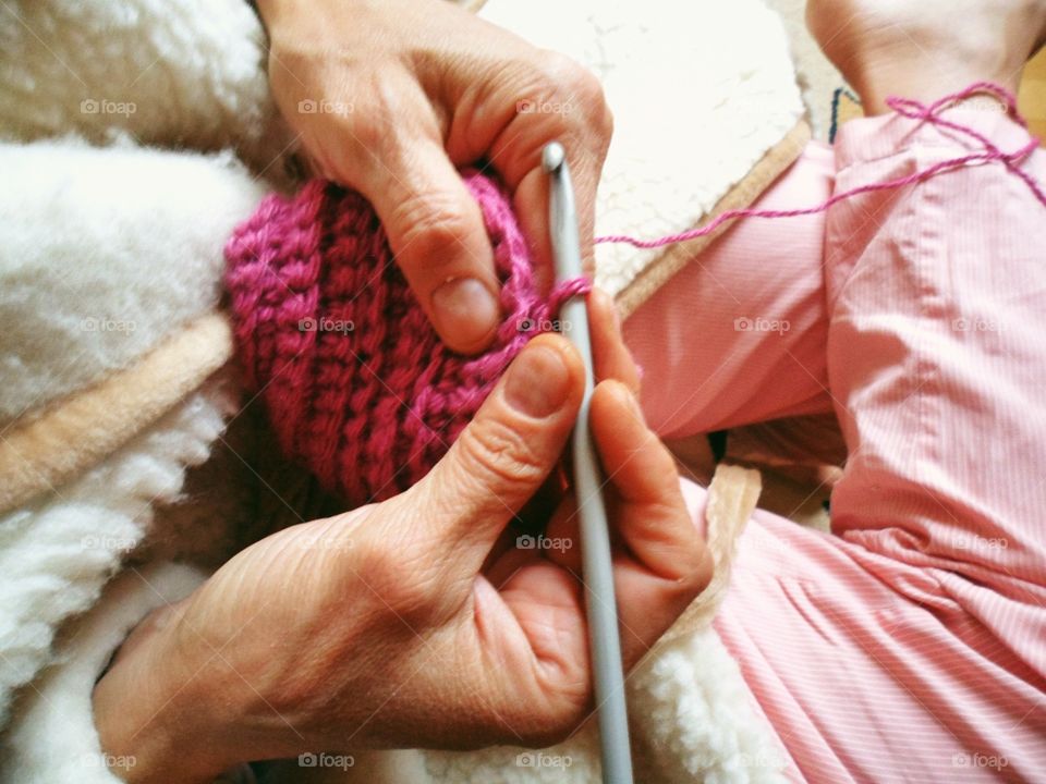 Woman crocheting hat