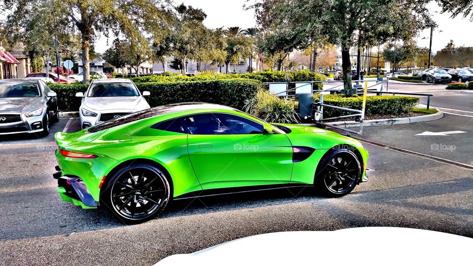 i had to snap a quick pic before it pulled off, i love Aston Martin!! and that color wow!