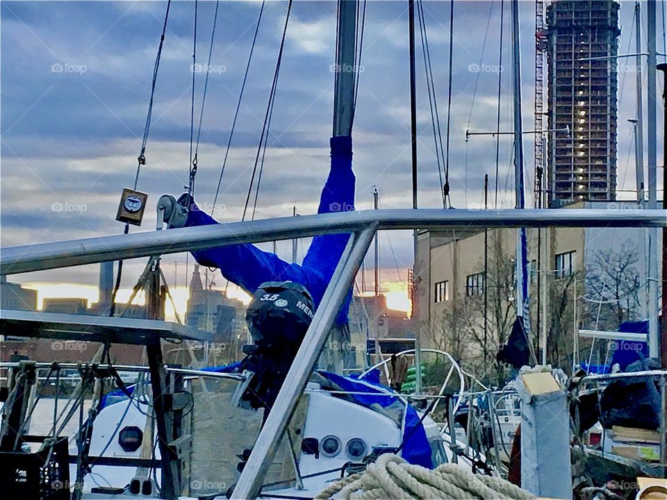 An assembly of nautical gear as seen from aboard our boat, the “Salvation” at Newtown Creek in Long Island City, Queens, NY on a partially overcast late afternoon in December 2021 just around sunset time. Hypnotic Productions