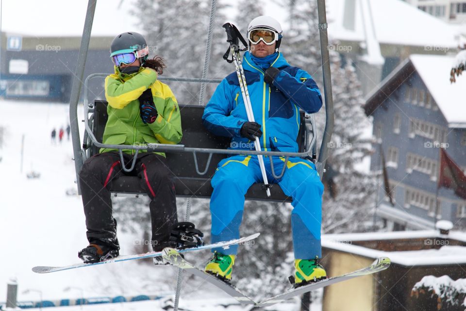 Skiers On Cable Car