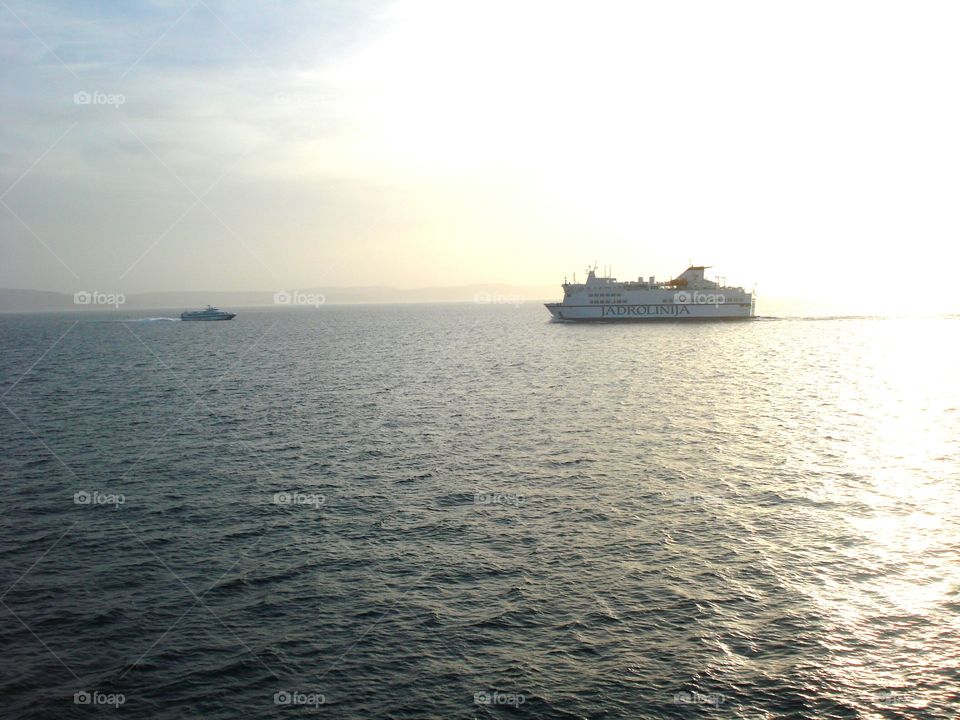The boat and the ferry on the Adriatic Sea