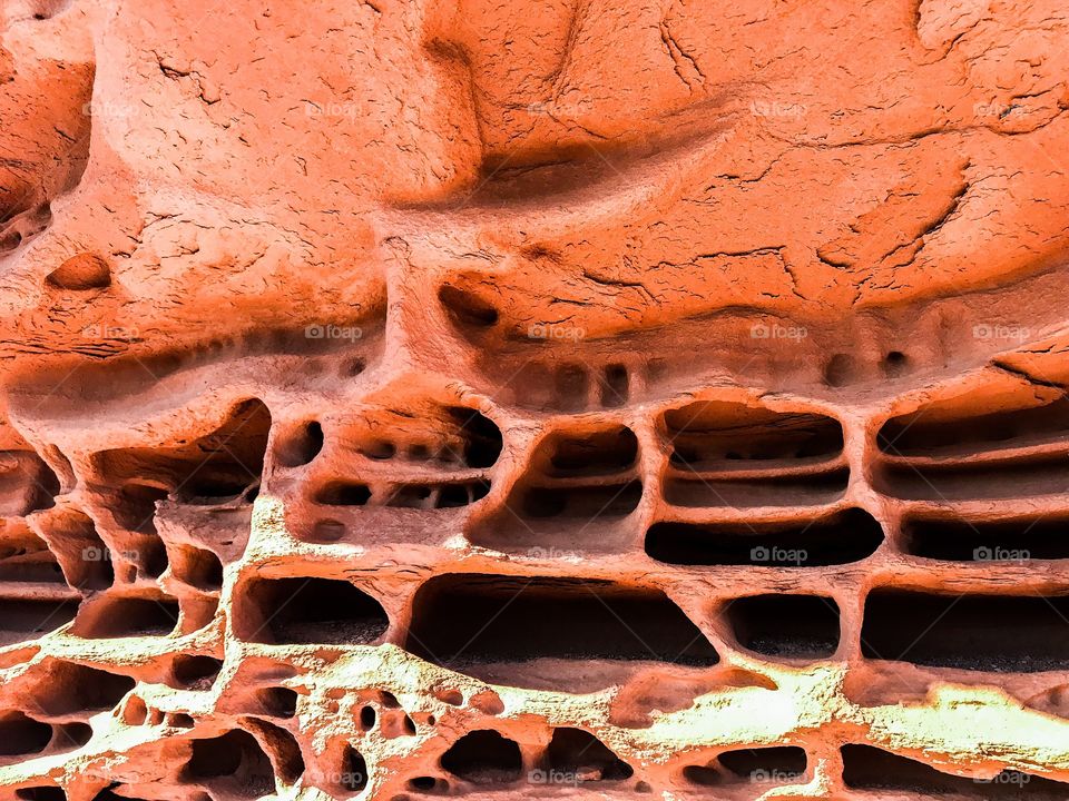 Red, weather worn, rock in Arizona desert 