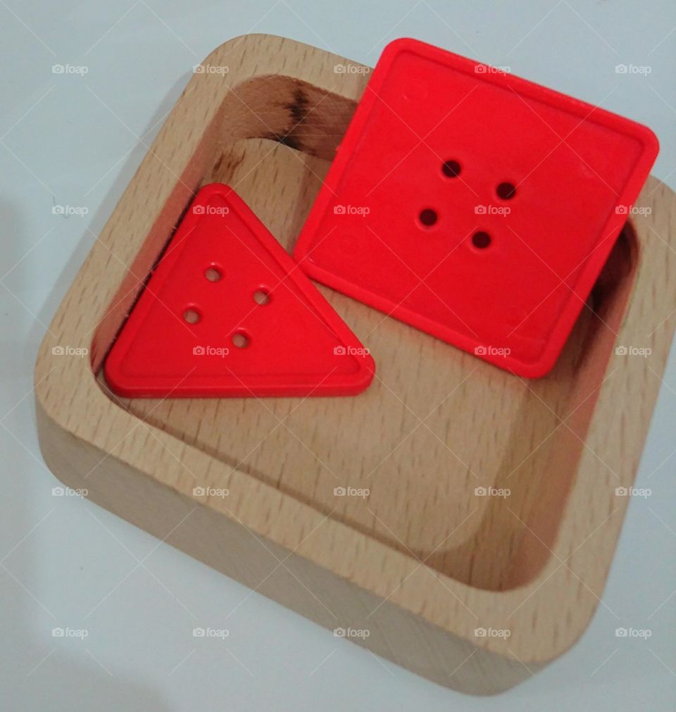 geometric triangle and square plastic red buttons, original designers ideea, creative exhibition wooden plate