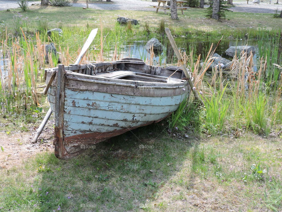Boat Docked Forever. Boat no longer sea worthy and grounded on land