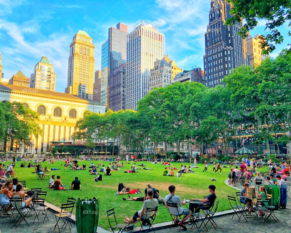 People enjoy a lazy Sunday afternoon at Bryant Park! 