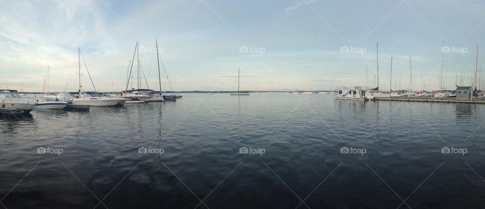 Yachts on calm lake panorama