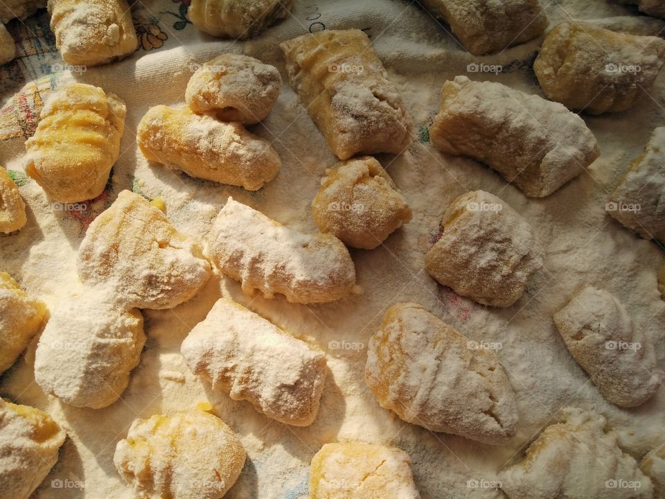 a macro pic of a quantity of fresh homemade gnocchi dumplings of potatoes