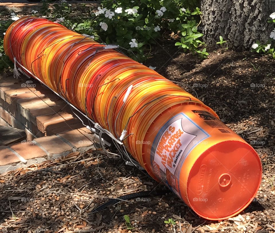 Random stack of orange buckets 