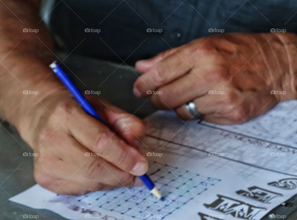 Hand Holding A Pencil. Hand Using A Pencil To Write
