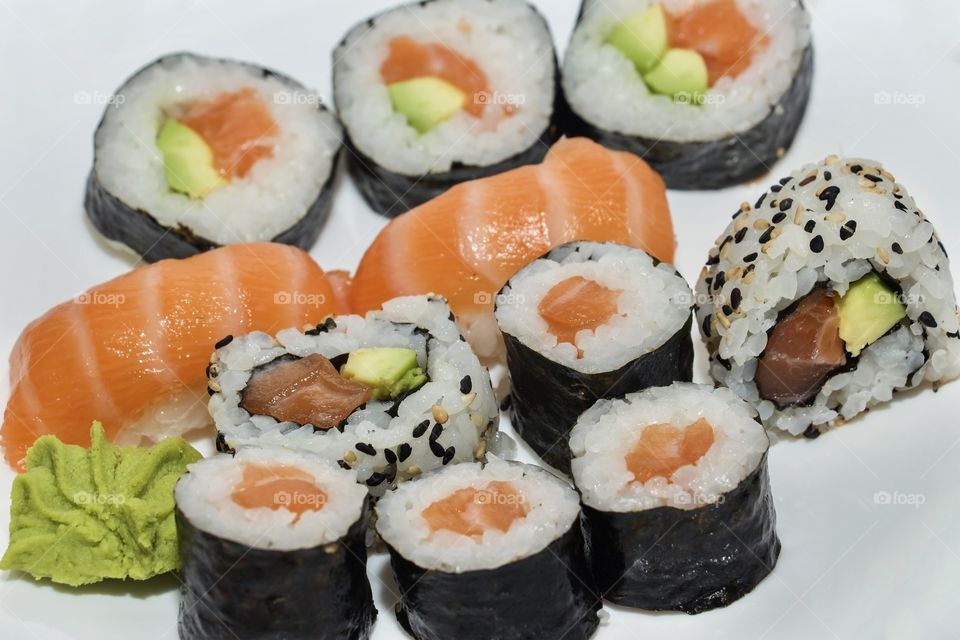Delicious sushi set in white plate