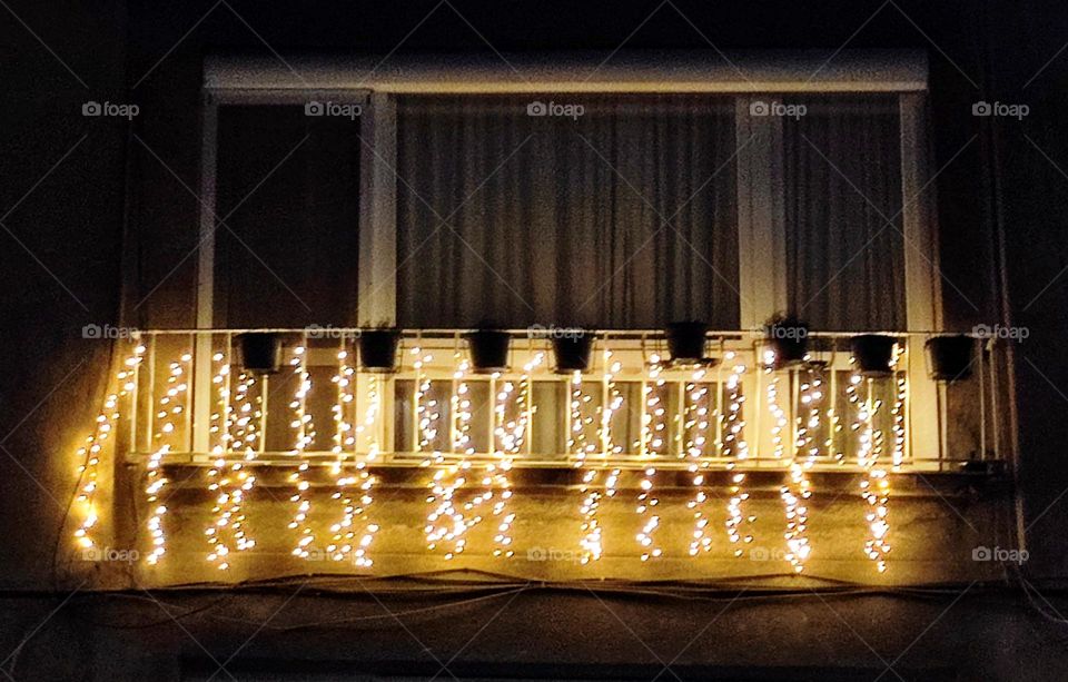 Christmas lights at the balcony exterior