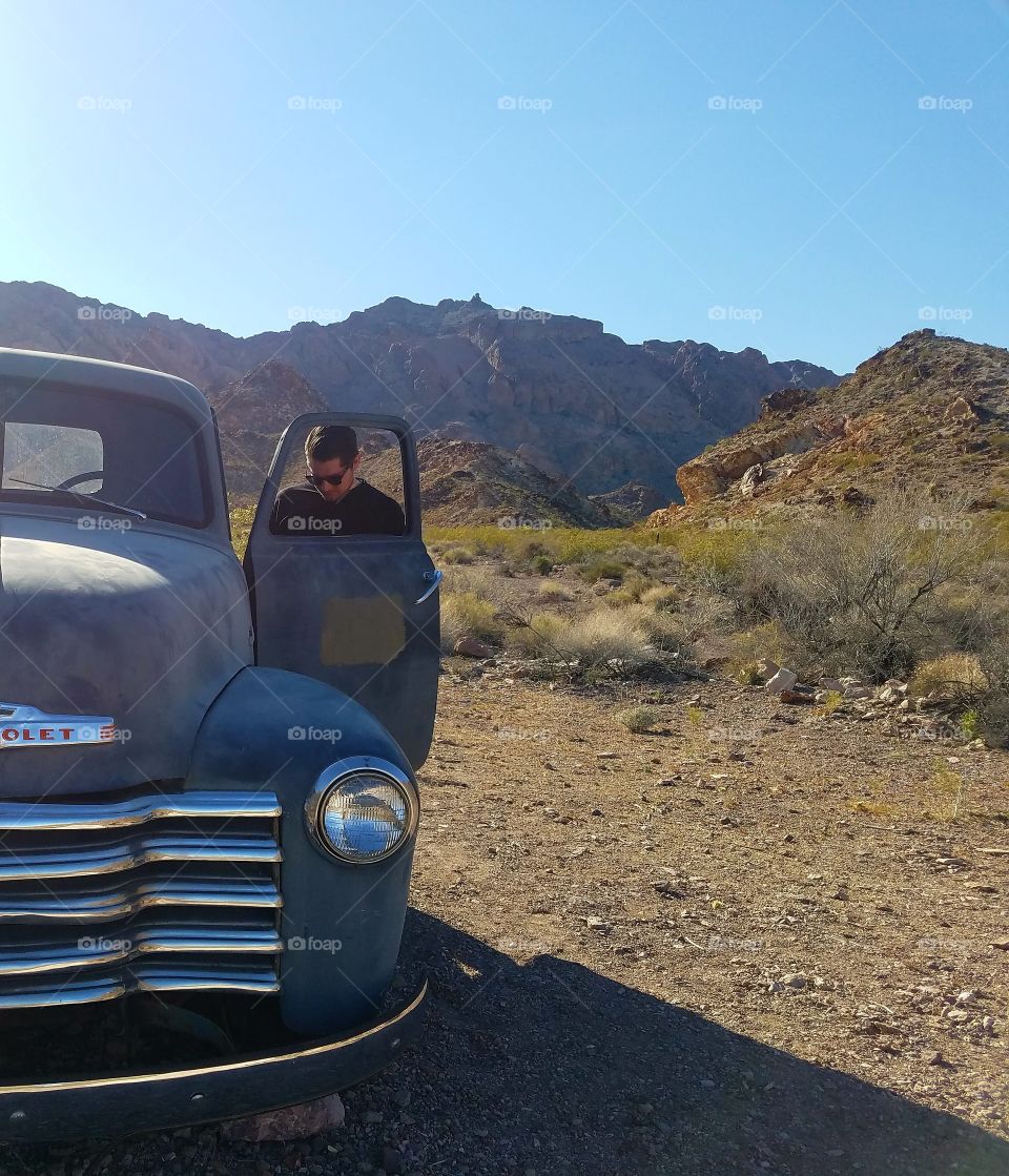 man taking old vehicle out for a drive.
