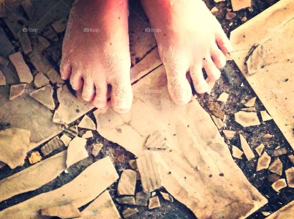 Bare feet in an abandoned building for the point of view competition