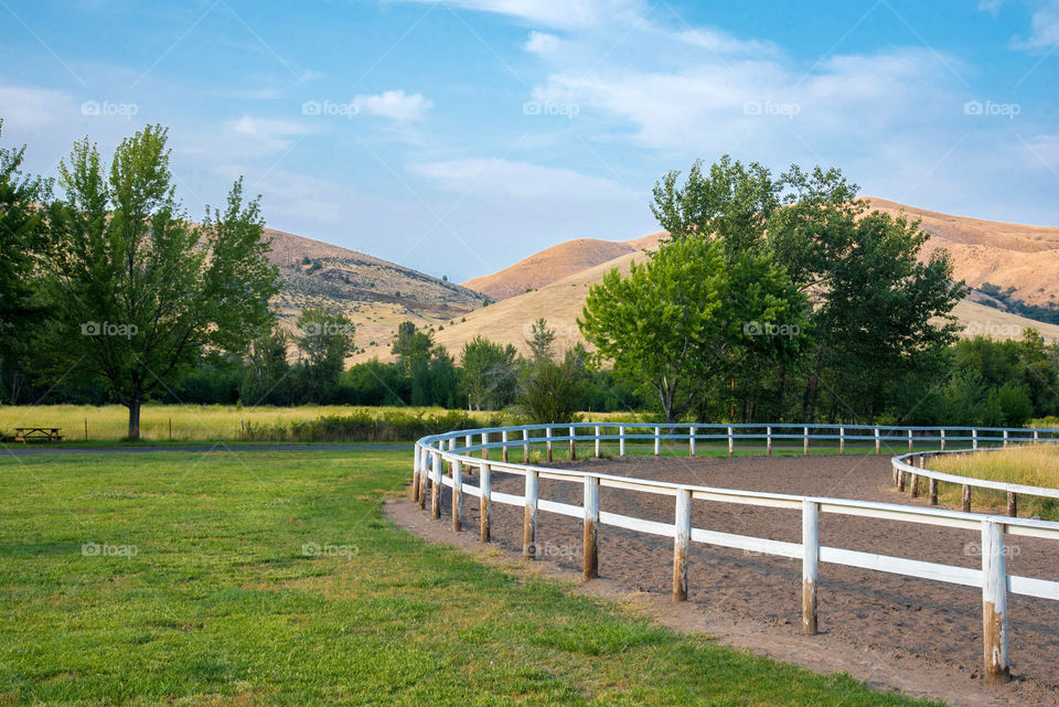 County fairgrounds horse track near trees and hills in Oregon