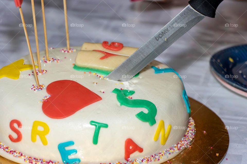 Cutting birthday cake