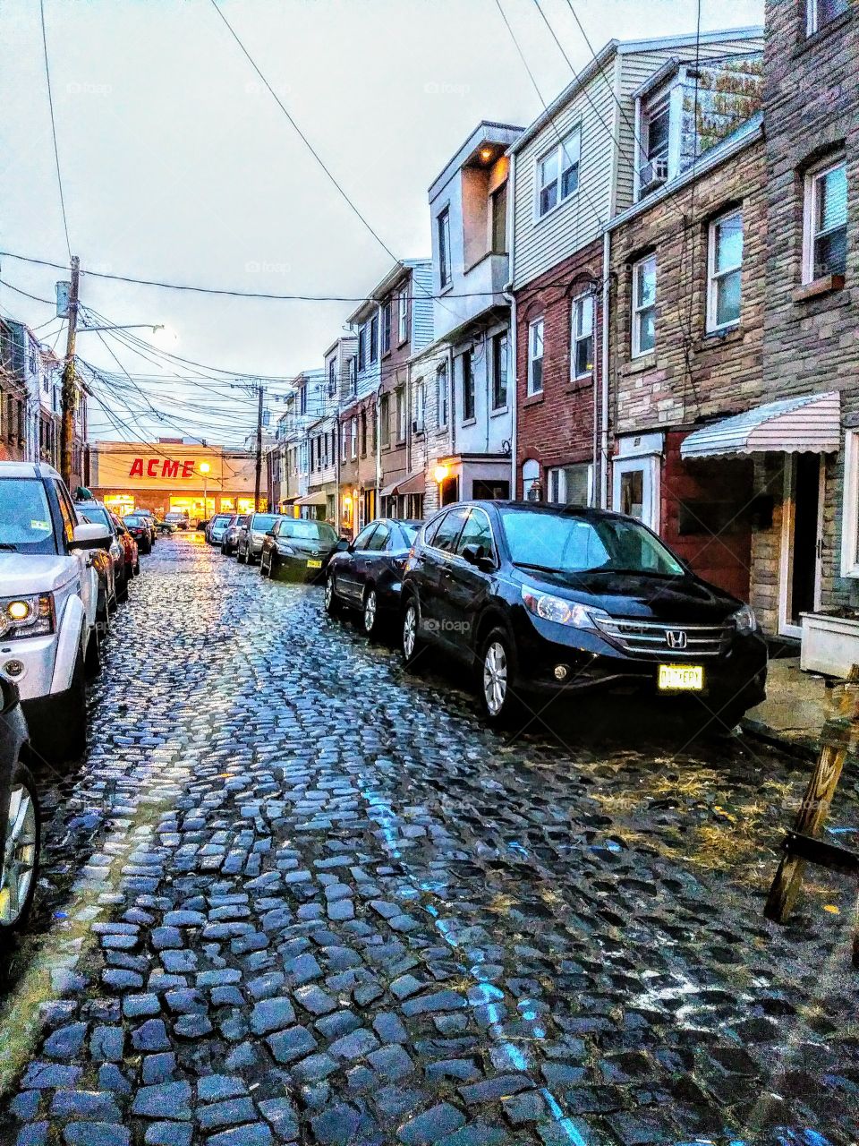19th century Hoboken New Jersey cobblestone street at beginning of rainstorm