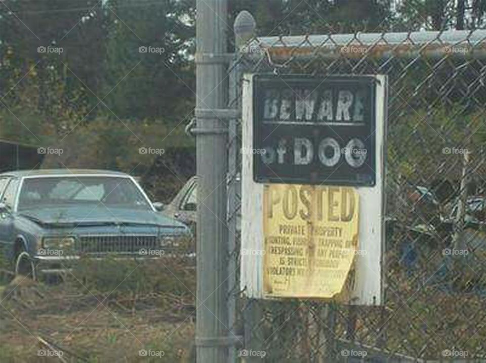 sign beware of dog junkyard