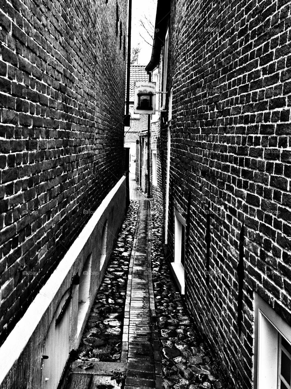 Narrow alley in Friesland.  At the port of Greetsiel.