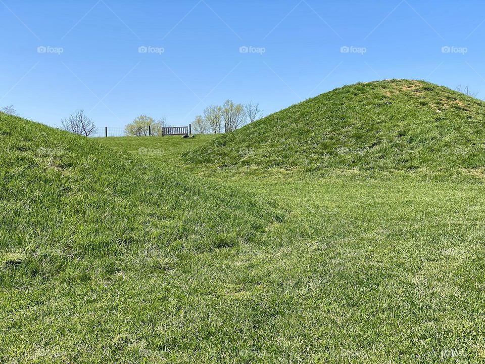 Hills and a bench at a local park