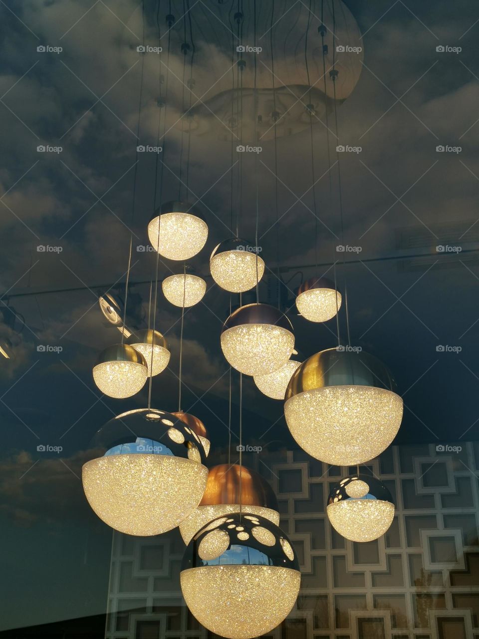 Shop window with chandeliers. Beautiful chandelier. Reflections in the glass, in the window.