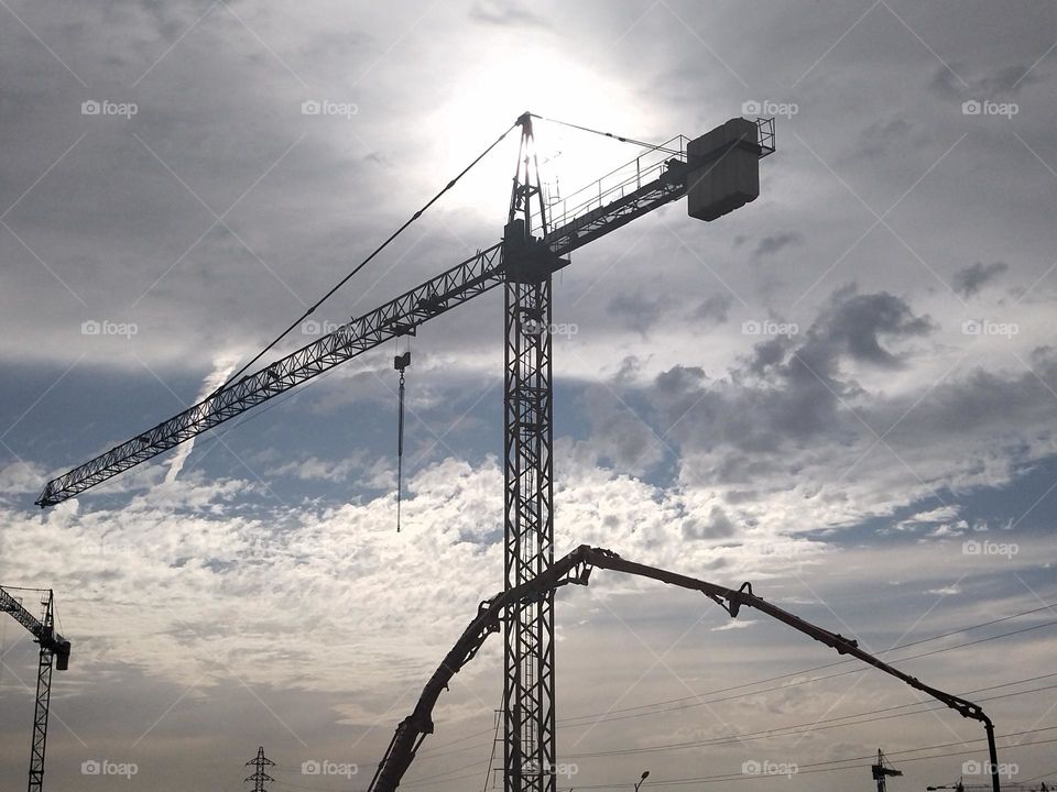 Worksite and cloudy sky