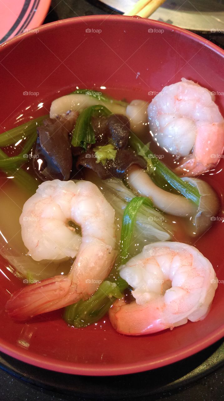 Seafood shabu, Japanese style soup with shrimp and mushrooms and vegetables.