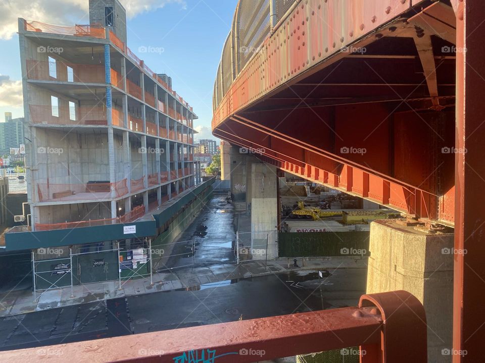 The minimal industrial aesthetic expressed in this photo elevates it to a whole other level. It is the red metal staircase leading up the “Pulaski Bridge” on the “Greenpoint”, Bklyn side and a construction site on the left. 2023. Hypnotic Productions