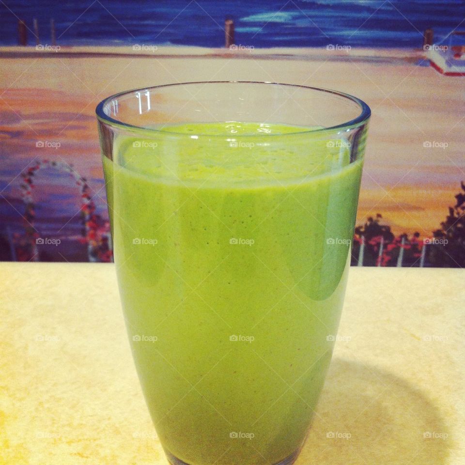 Green Smoothie. A lovely, healthy green smoothie I made with a beach mural background. 