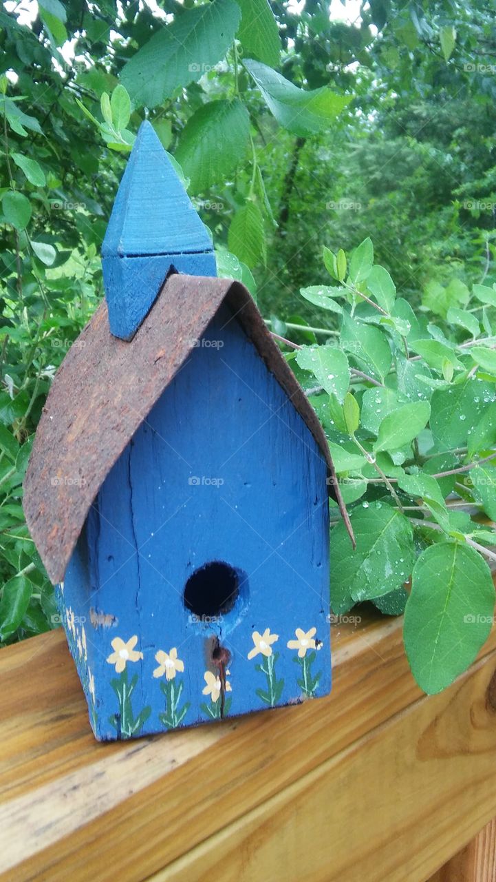 church birdhouse rustic handmade nature country beautiful lush green closeup blue deck outside display country