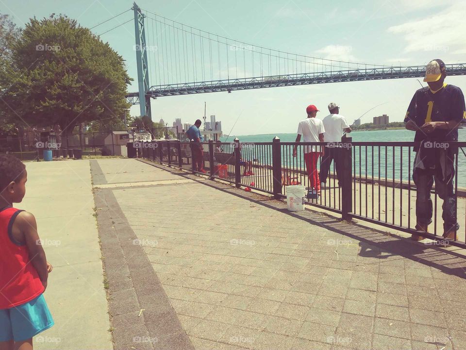 ambassador bridge to Canada crom Detroit river side fishing
