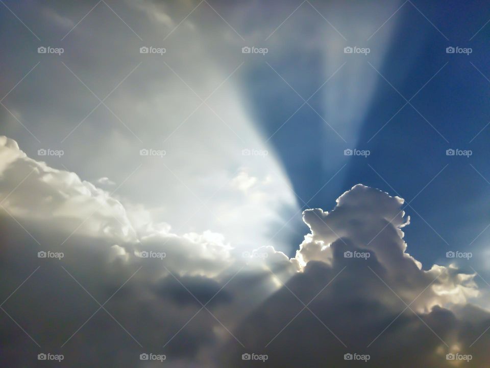 sun rays appears through the clouds