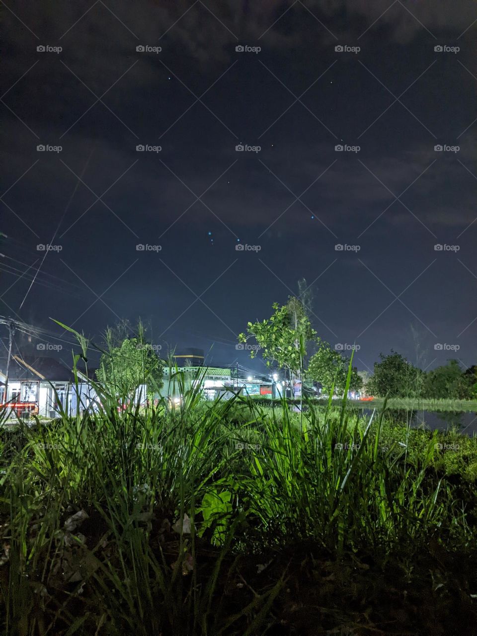 village atmosphere, in another village at night