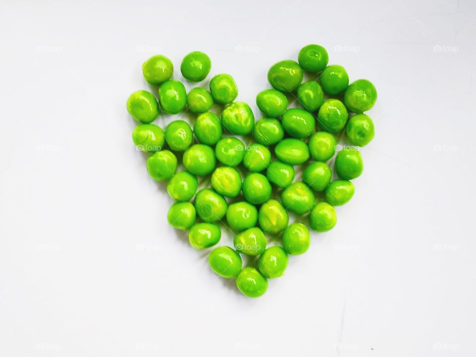 Green heart made of peas