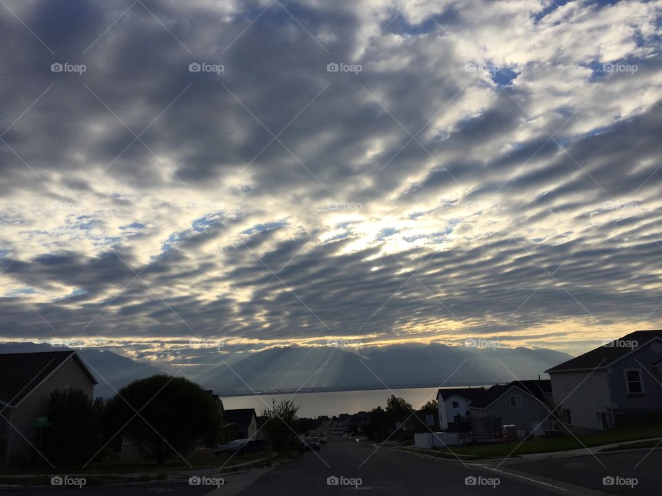 Rippled clouds over mountains and lake
