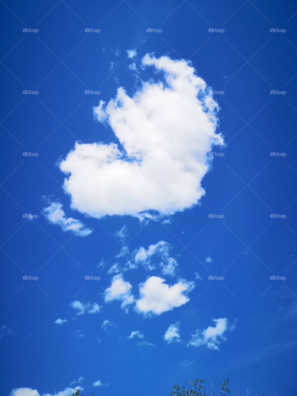 An heart-formed cloud in the blue sky. Saint-Lambert. Québec. Canada