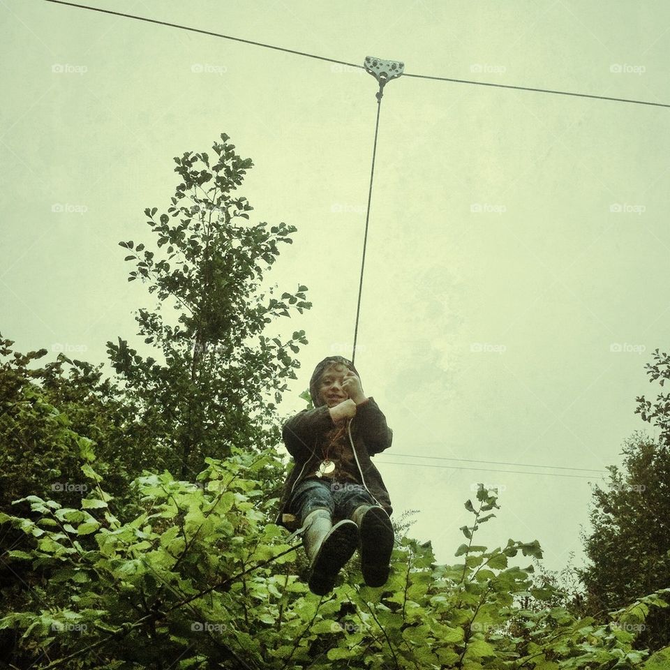 Boy on a zip wire