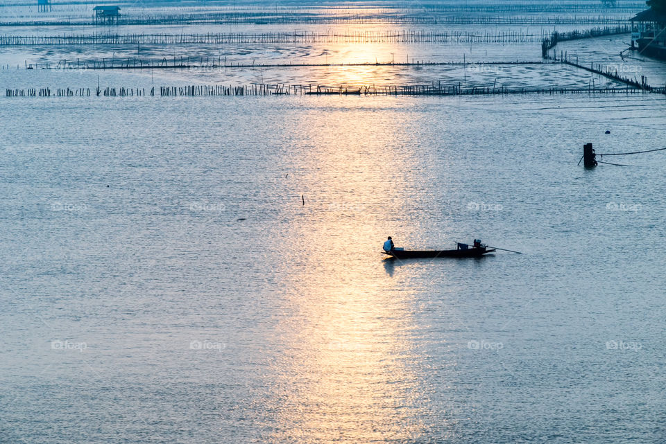Sunrise and Fisherman