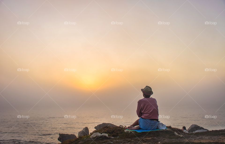 a picnic by the ocean at sunset